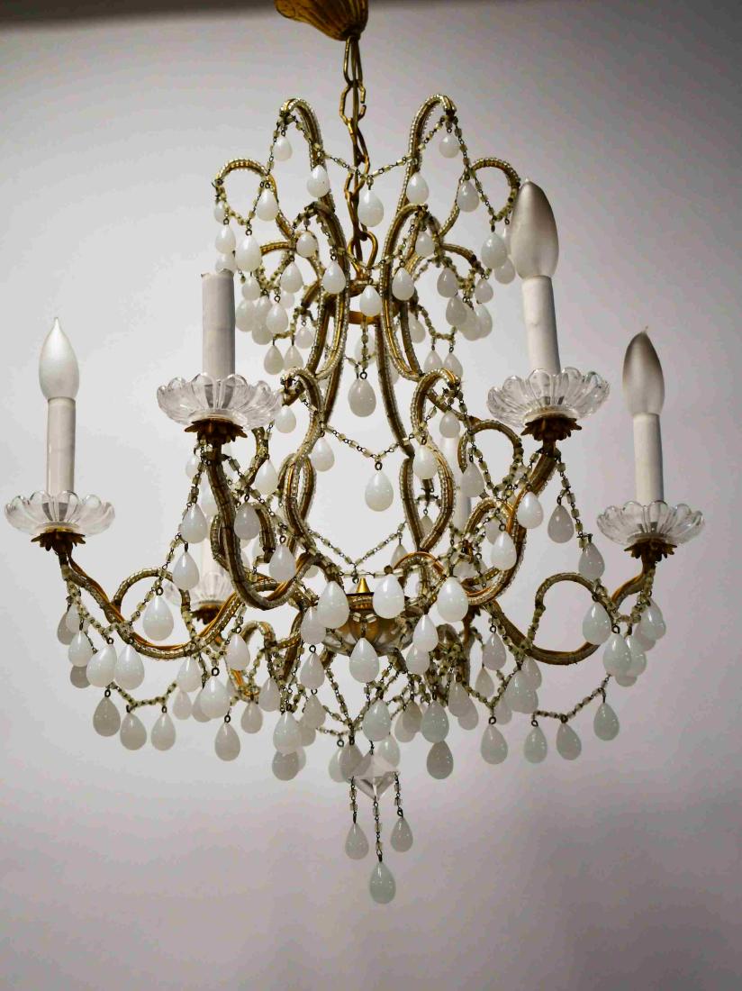 Vintage French Opaline Glass Regency Chandelier: French Regency chandelier. Opaline glass and gilt brass six arm frame with tear drop pendants and draped chains. Excellent condition. Measures 20" dia x 18".
