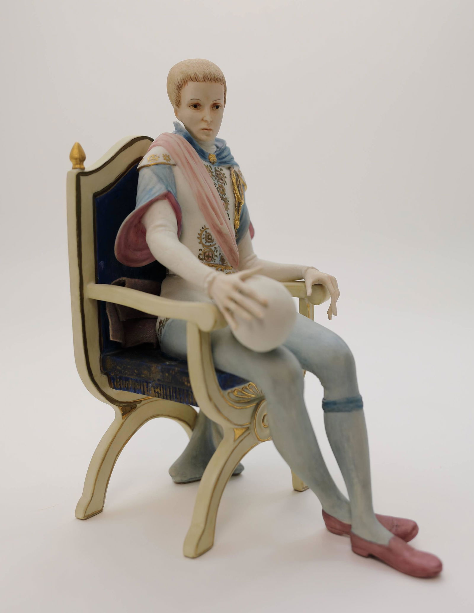 Vintage Cybis Porcelain Figure Hamlet w Yorick: Vintage Cybis porcelain figure of a Hamlet seated in a Savarona chair while holding the skull of Yorick. Excellent condition. Measures 6" x 8" x 10".
