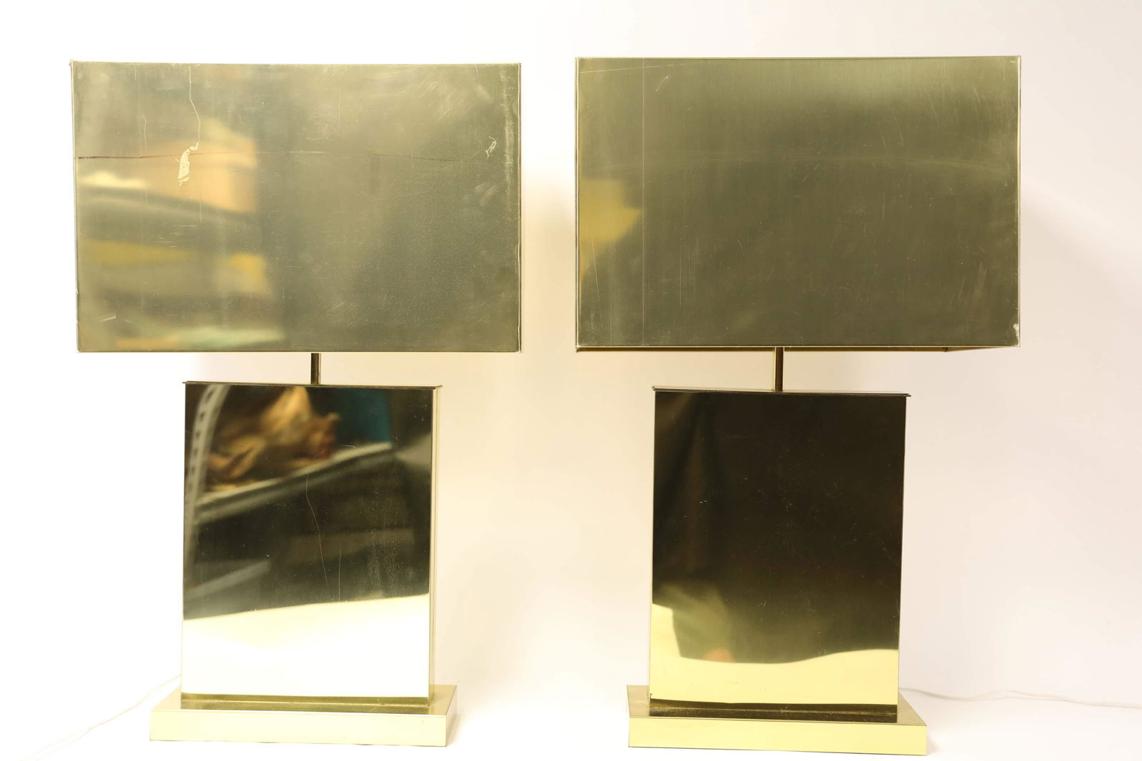 Pair Jere Polished Brass Rectangular Cuboid Lamps: Pair of circa 1976 Curtis Jere polished brass rectangular cuboid lamps. Large lamps with opaque shades signed en verso with original store tag. Excellent vintage condition. Measure 21.5" x 12" x 33"