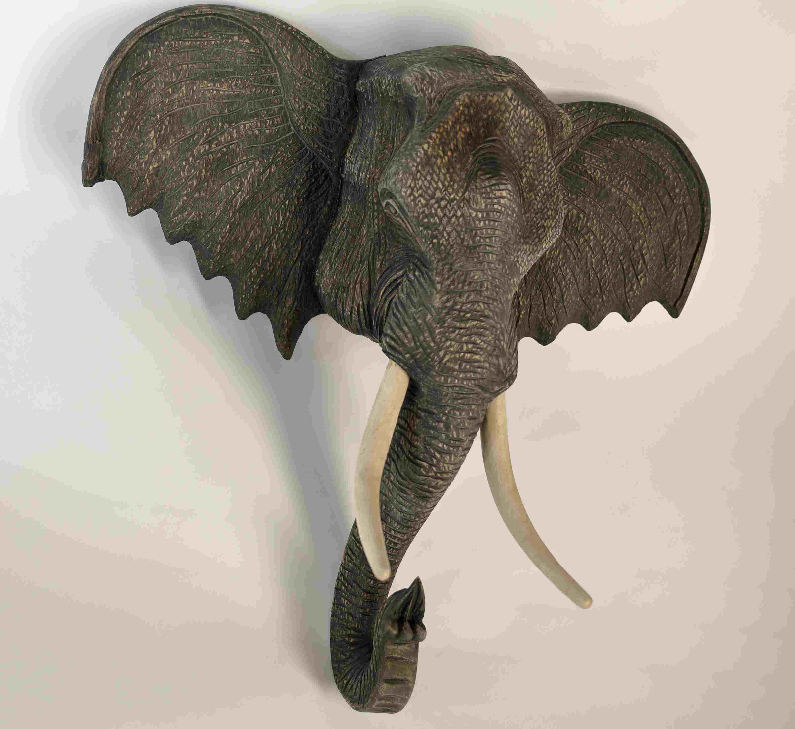 Lg Vintage Wood Elephant Taxidermy Head w Tusks: Large carved wood elephant head in the form of a taxidermy mount with tusks. Well finished and painted wall mounted elephant head. Excellent condition. Measures 36" x 18" x 36".