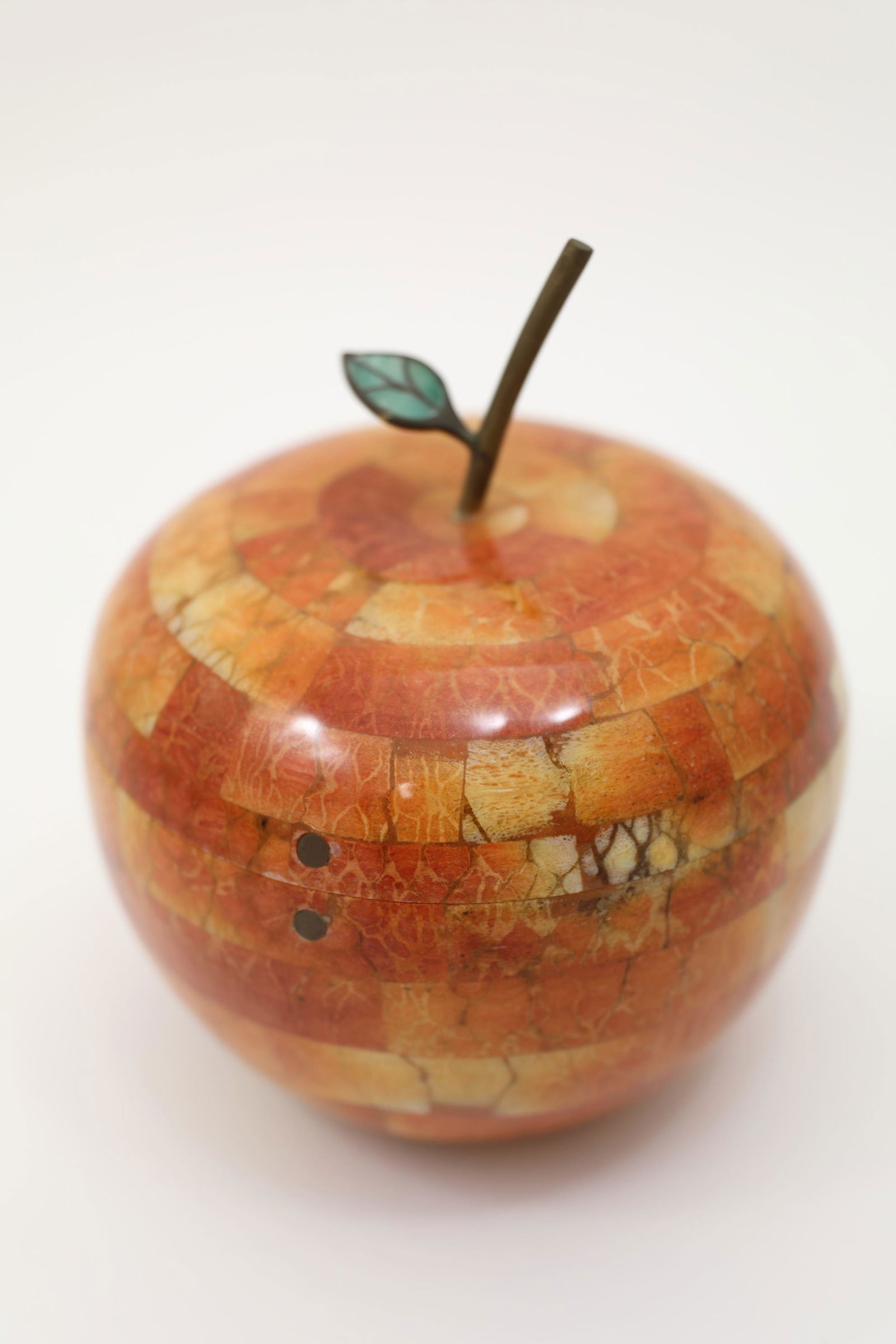 Maitland Smith Apple Form Jewelry or Dresser Box: Maitland Smith apple form jewelry or dresser box. Oversized apple with brass stem and inlaid malachite leaf with a dyed camel bone veneer. Excellent condition. Measures 6.5" dia x 8".