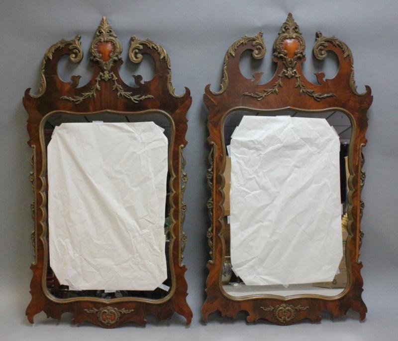 (2) French Empire Antique Carved Wood Mirrors: Two French Empire style carved wood mirrors. Excellent and very good condition, one mirror repaired at the crest. Measure 28" x 51.5" each.