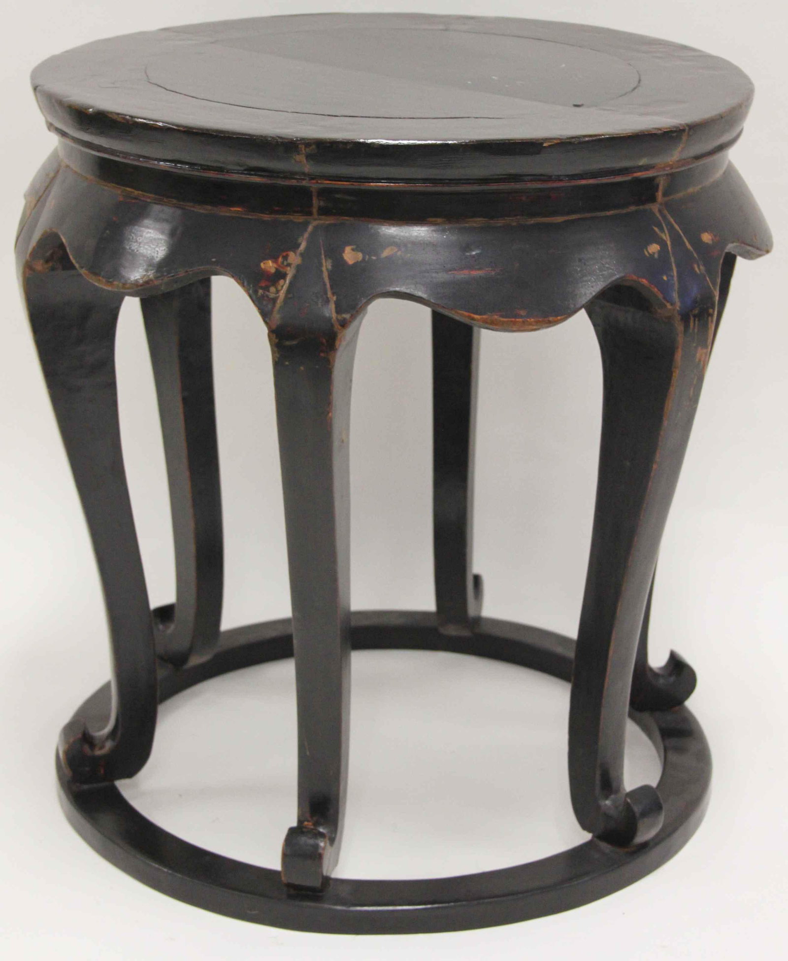 Antique Chinese Hardwood Black Lacquer Side Table: Antique Chinese hardwood side table. Black lacquer finished taboret style table has six scroll legs on a circular base. All wood mortise and tenon construction. Excellent / very good condition. Measur