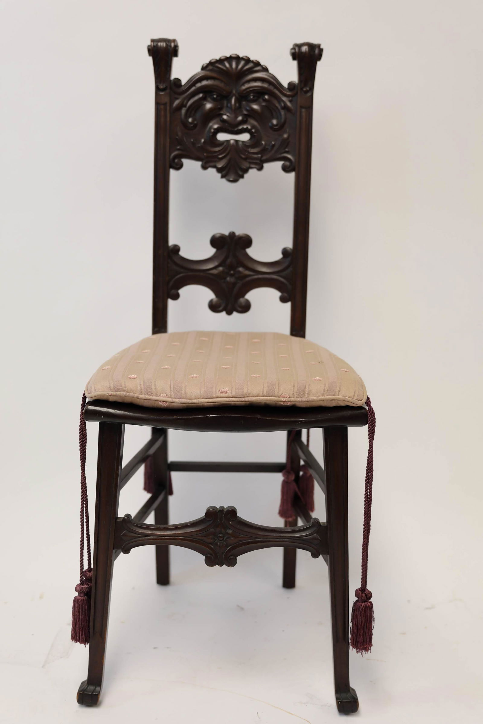 19c American Gothic Side Chair w North Wind: 19th Century American Gothic walnut side chair. Back rest of chair is carved with an allegorical North Wind figure and accented with gothic stretchers. Excellent condition. Measures 17" x 17" x 40".