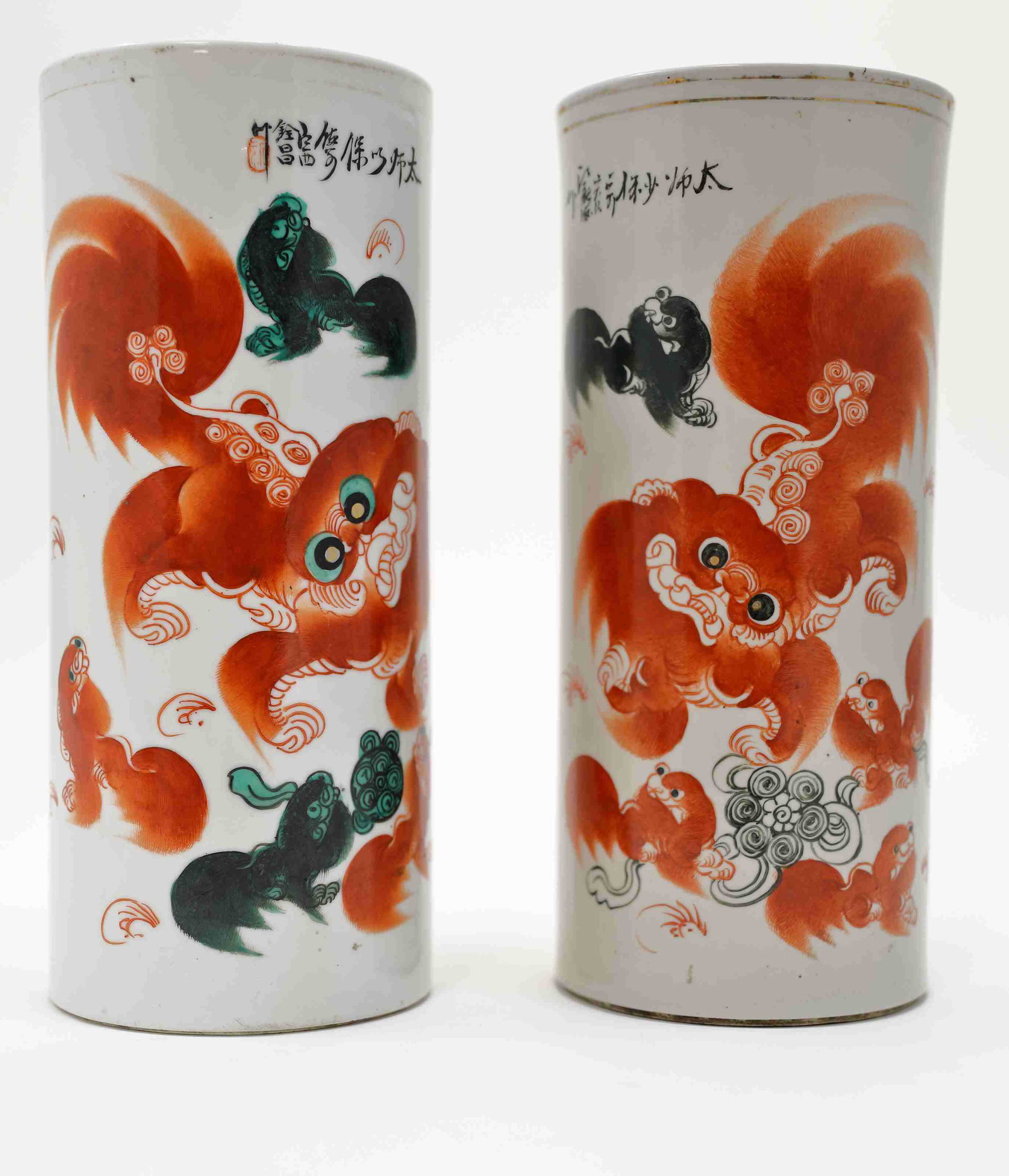 Pr Oriental Brush Holders Shishi Lions Calligraphy: Pair of Oriental brush holders. Shishi lion or Foo dog decorated vases are calligraphy and chop mark inscribed. Excellent condition, (minor wear at gold rim). Measure 4.75" x 11.25".