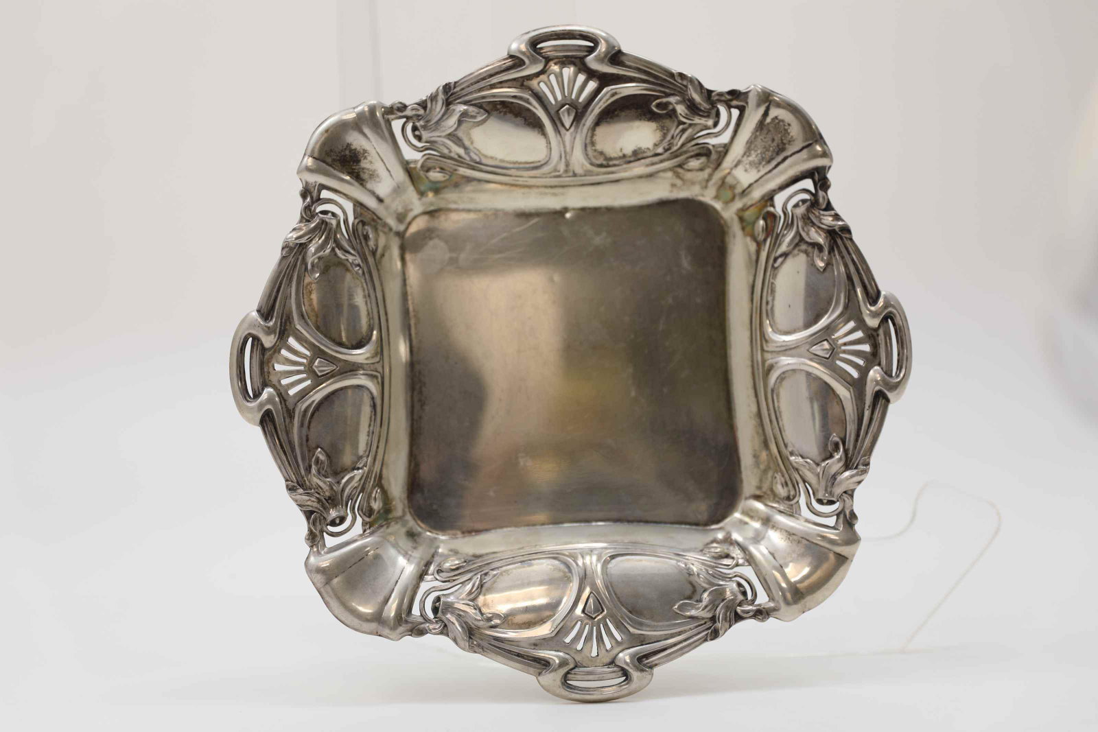 Art Nouveau German Sterling Serving Tray w Lilies: Art Nouveau German 800 silver four handled bon bon or cake serving tray with pieced accents and lilies. Excellent condition. Measures 10.25" x 10.25" x 1.5". Weight = 8.5 troy oz