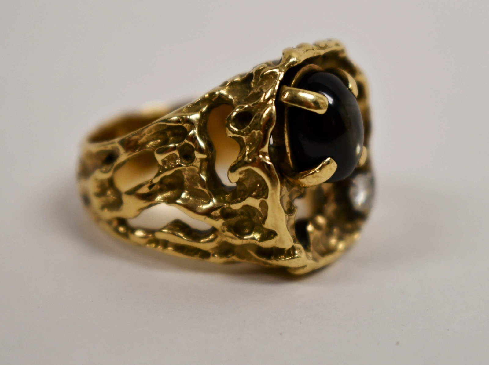 14k Men's Brutalist ring w Star Sapphire & Diamond: Vintage 14k Men's Brutalist gold nugget ring with am 8mm x 10mm star sapphire and a 2mm diamond. Ring size 9.5 Weight =- .58 troy oz.