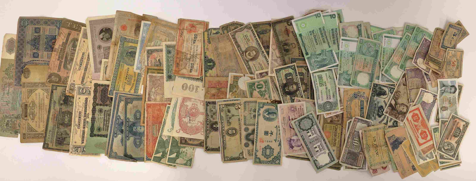 World Collection Antique & Prewar Paper Currency: Worldwide collection of antique and prewar paper currency collected from various estates. Over 100 pieces of currency dating to the early 1900's. Never sorted or examined.