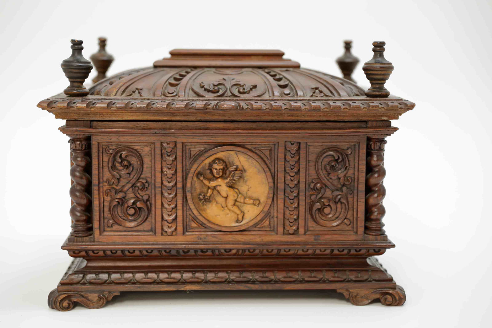 Carved Walnut Gothic Revival Dresser Box w Cherub: 19c Walnut Gothic revival lidded dresser box decorated with a carved cherub medallion and initialed JFS en verso. Stamped by the carved Heptali Martinez dated 1952. Excellent condition. Measures 15" x