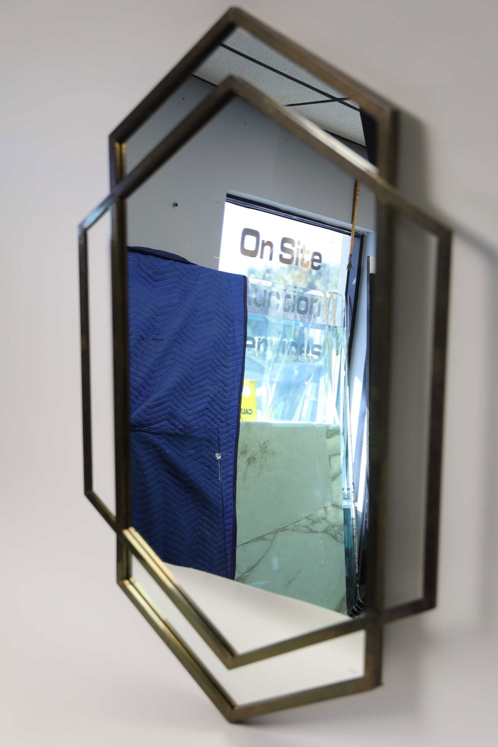 Mastercraft Interlocking Hexagons Brass Mirror: MCM Mastercraft attributed interlocking hexagonal brass framed mirror. Excellent condition. Measures 31.5" x 47".