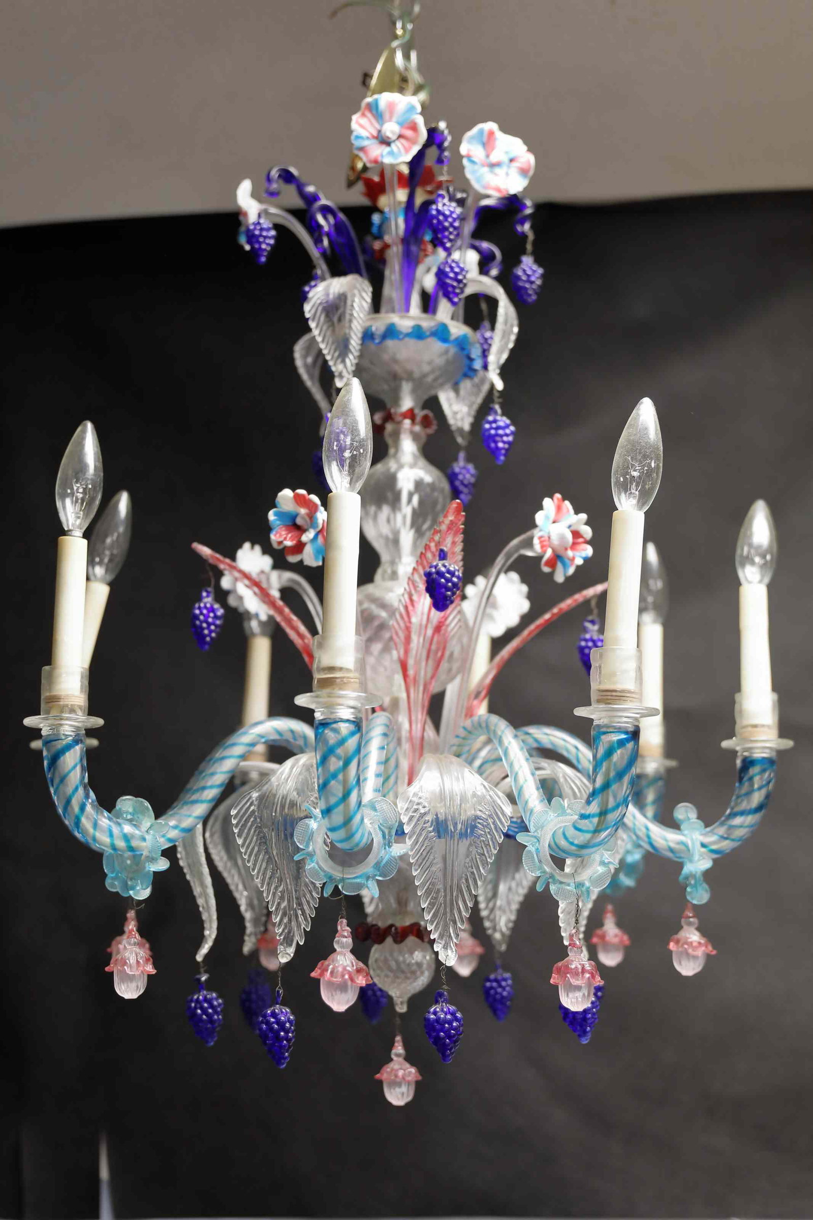 Hollywood Regency Murano Floral 8-light Chandelier: Vintage Hollywood Regency Murano art glass eight light chandelier with multihued floral form glass. Excellent condition. Measures 24" dia x 30".