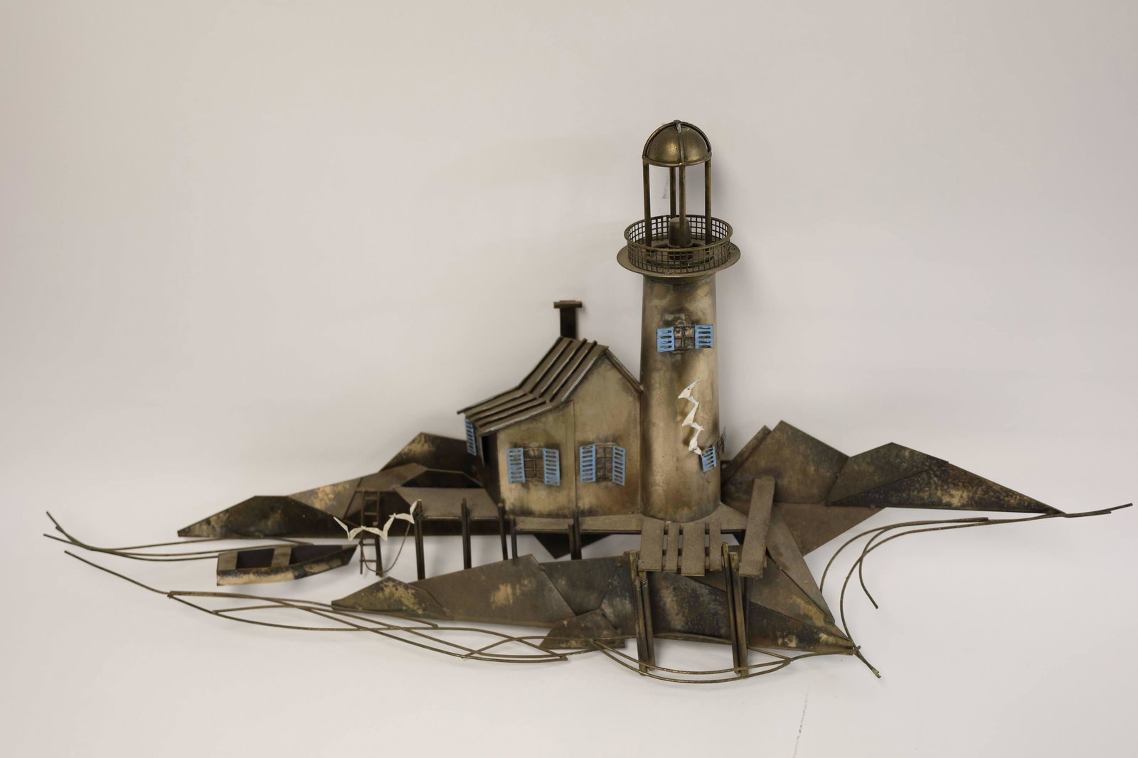 Curtis Jere Sculpture Lighthouse on Shoal w Dock: Curtis Jere metal sculpture. Sculptural metal lighthouse on a shoal with dock and shore birds. Excellent vintage condition. Measures 50" x 10" x 24".