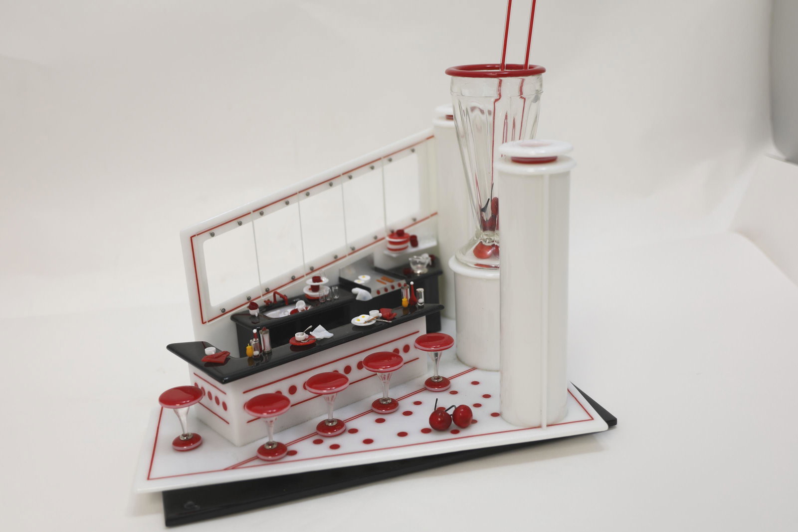 Emily Brock Art Deco Style Glass Diner Sculpture: Emily Brock Art Deco Style Glass Diner / Soda Fountain Sculpture. Miniature glass sculpture with kitchen and diner bar with stools. Features large milkshake / soda glass with straws. Signed and date 1