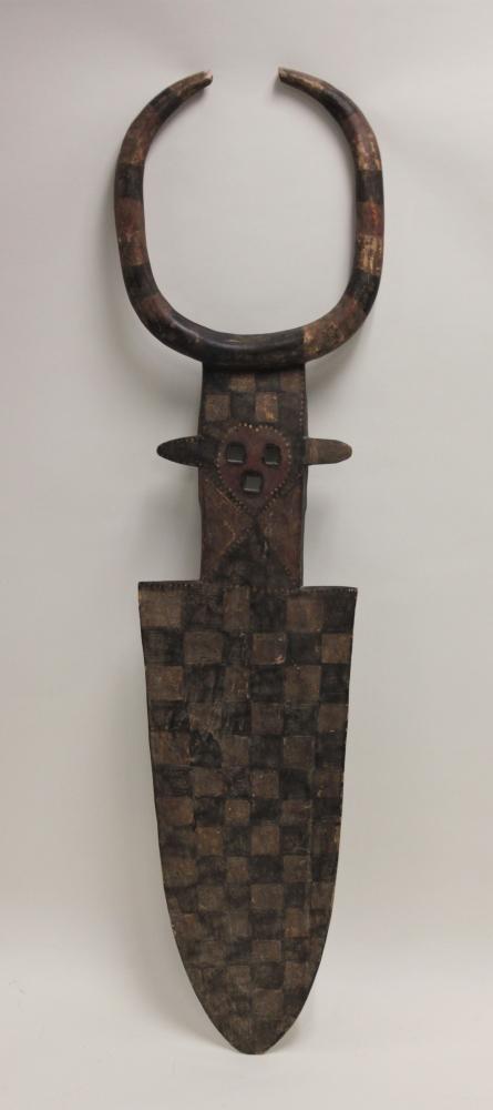 Large Ivory Coast, African Nafana Bedu Tribe Mask: Large Burkina Faso / Ivory Coast, Africa Nafana Bedu or Gurunsi tribe ceremonial mask. Ochre and ash painted carved plank form mask with horns. Excellent condition. Measures 17" x 4" x 66".