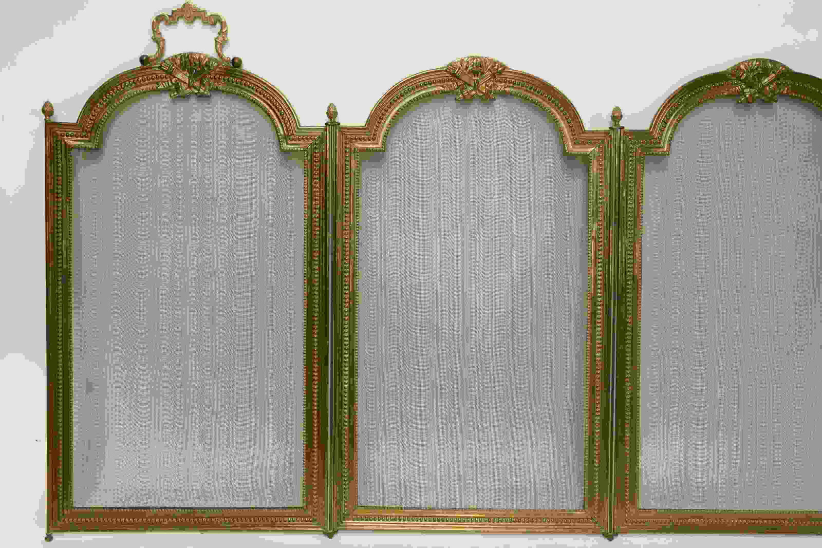 19th C. French Louis XV Style Fire Screen: 19th Century French Empire style fire screen topped with crossed torches emblem. Four panels separated by pineapple finials, ends with handles. Excellent condition. Measures 53" x 24.5".