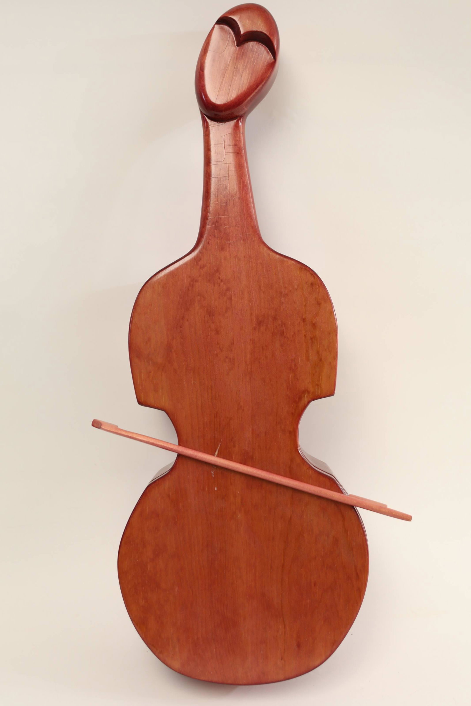 Picasso Influenced Cello Shaped Wall Cabinet 1995: Picasso Influenced Cello Shaped Wall Cabinet. Lid has applied bow and opens to reveal seven drawers, four small above three larger. Singed illegibly on back (possibly JoAnne Carson) and dated 1995. Ex