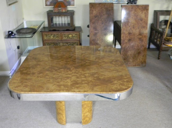 Milo Baughman dining table w/ leaves: Milo Baughman pedestal dining table with two leaves. Burl wood and chrome. 48" x 30" x 48", with leaves: 88" x 30" x 48".