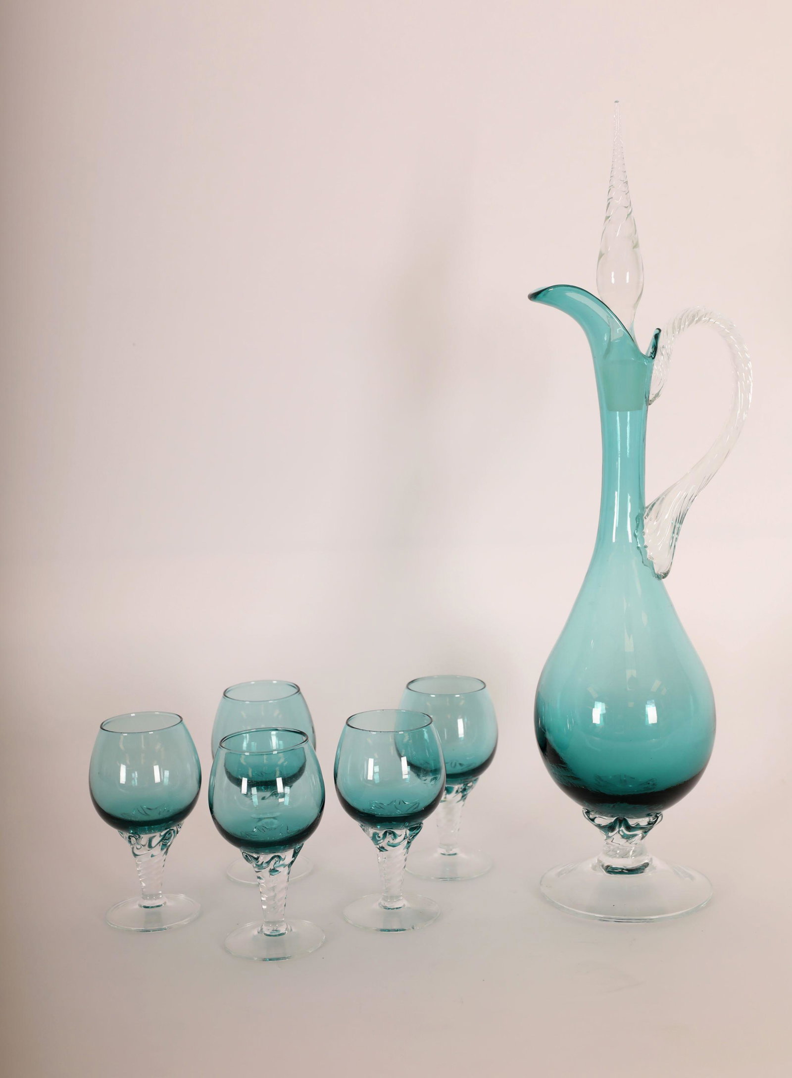 Vintage Venetian Claret Set (5)Glasses (1)Decanter: Vintage Venetian claret set with (5) glasses and (1) decanter with spiral bases and handle. Decanter has elongated neck and teardrop shaped stopper and frosted base. Excellent condition (one glass has