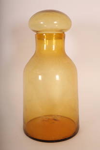 Large Blenko Blown Glass Stoppered Vase: Large Blenko blown glass oversized decanter vase. Amber colored vase has short neck and rounded stopper. Excellent condition. Measures 9"dia x 19".