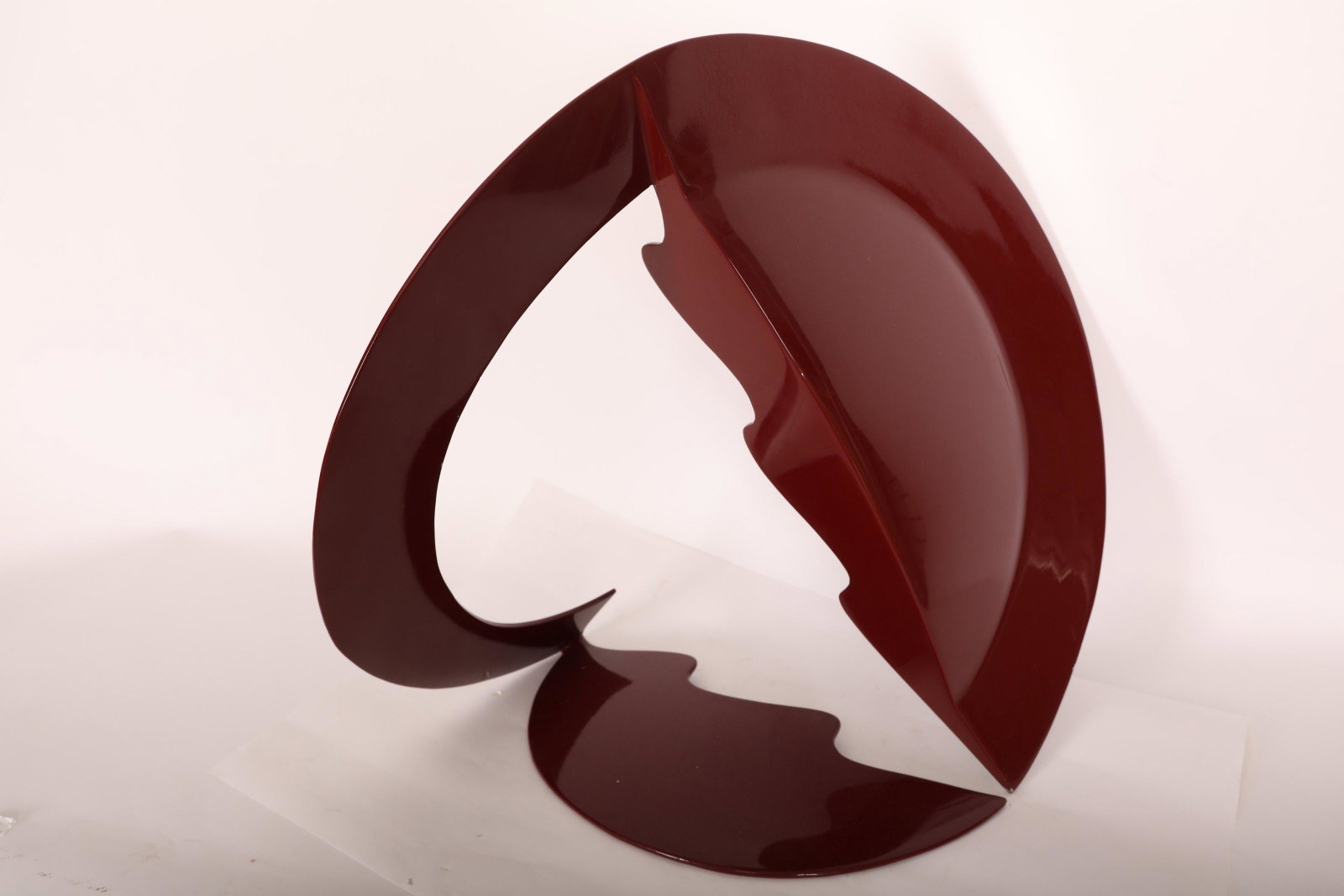 Ann Baver Contemporary Enameled Steel Sculpture: Ann Baver contemporary kinetic enameled steel sculpture "About Circles" 1980. Fashioned with curves and two wave form edges. Initialed "A.B." on bottom. Excellent/very good condition (scratches on rim
