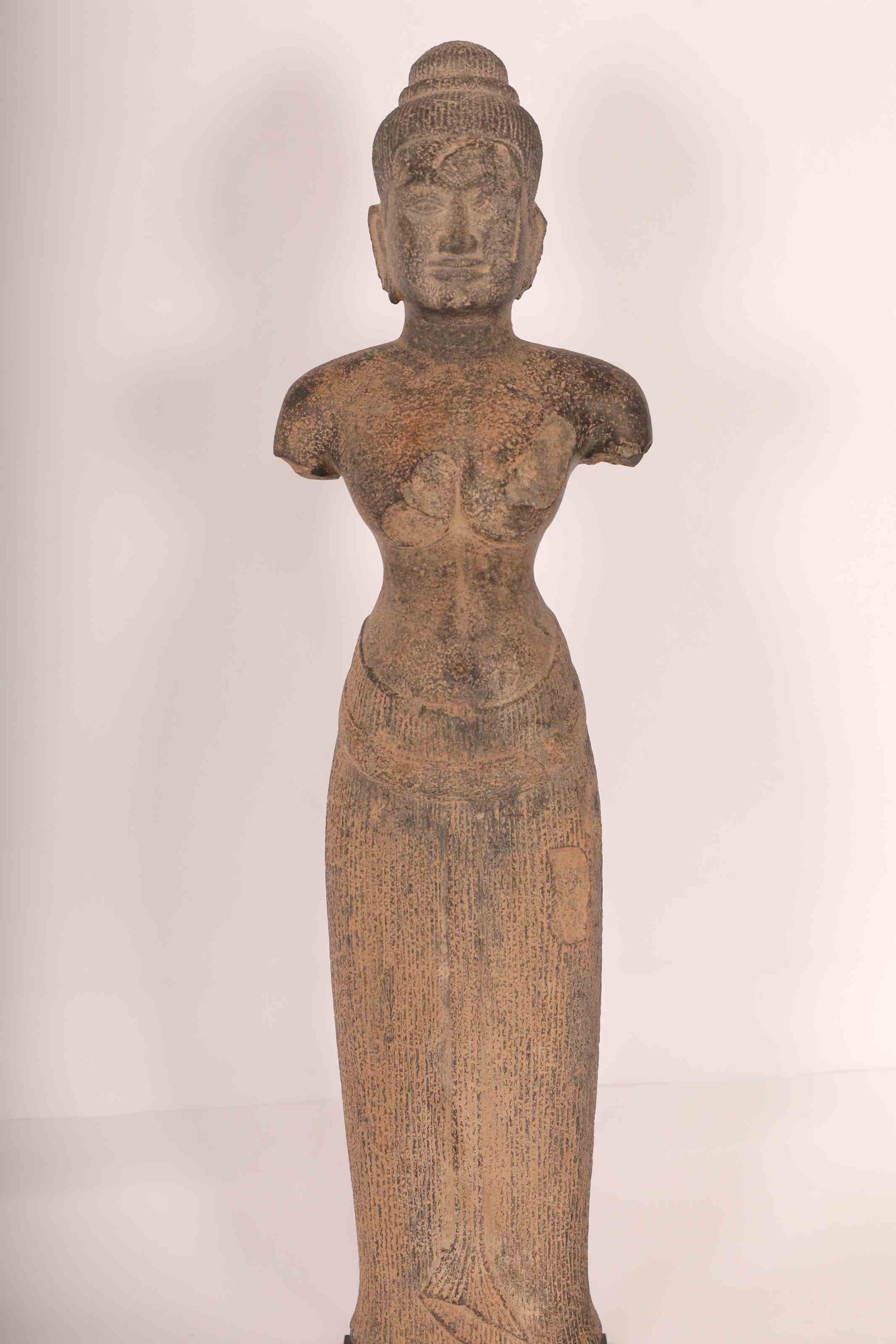 13th C. Artifact Ankgor Wat Khmer Female Deity Statue: Large 13th century Artifact Ankgor Wat Khmer Cambodian female deity statue of carved stone. She bears a nude torso wearing a skirt in an unyielding stance. Excellent condition (appropriately aged with