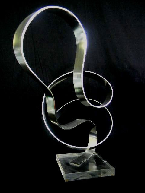 Dan Murphy Acrylic and Metal Sculpture: Large abstract polished aluminum sculpture set on acrylic base. Signed by the artist, Dan Murphy,1979. Base measures 6.5" square. Sculpture measures approximately 11" x 18.5" x 18.5". Dimensions: 11"