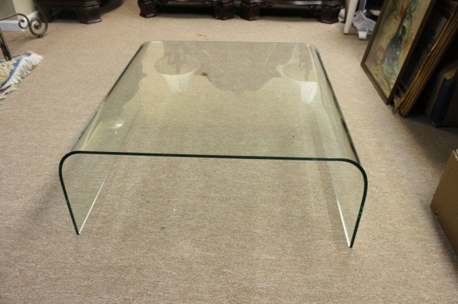 Italian Fontana Arte Solid Glass Coffee Table: Italian-made Fontana Arte coffee table designed by Pietro Chiesa made from curved and ground float glass (15mm thick). Has one small nick, and a few scratches as shown (can be ground out). Dimensions: