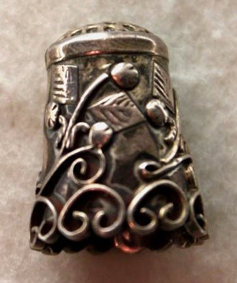 German Silver Art Nouveau Sewing Thimble: German silver art nouveau sewing thimble. Stamped .925. Dimensions: .75"d x 1" Style/Time Period: Vicorian