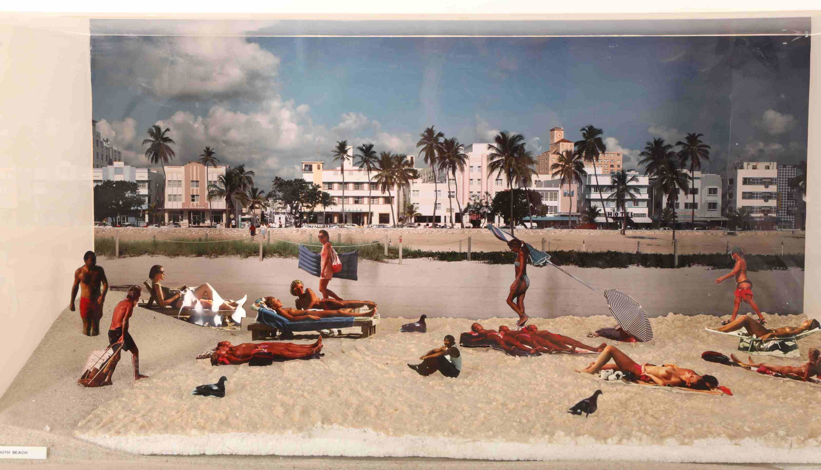Modern Earl Bronsteen Diorama "South Beach" w Nude: Modern Earl Bronsteen (American, 1926-2014) Diorama entitled "South Beach". In front of a South Beach back drop, cut out figures lounge and traverse the beach including topless women. Excellent condit