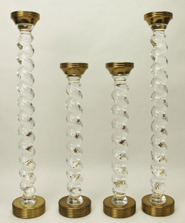(4) Italian Swirl Lucite & Brass Candlesticks: Set of (4) very large and heavy lucite / acrylic and brass Italilan swirl candlesticks. All (4) measure 3 1/2"D at the top and 4 1/2"D at the base. The 2 shorter pieces measure 19"tall and the 2 large