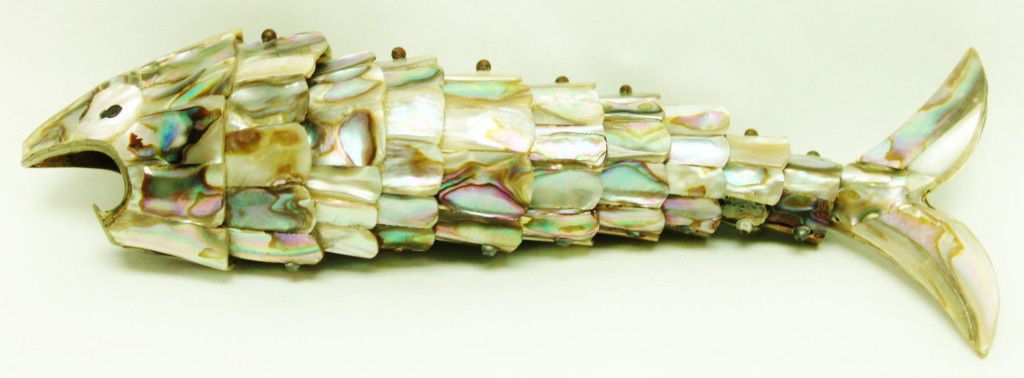 Abalone and Silver Plate Fish Bottle Opener: Abalone shell and silver plated bottle open in the form of an articulated fish. Dimensions: 7 1/2" x 3" x 1 1/2" Style/Time Period: MId-Century