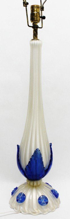 Gold Fleck Murano Art Glass Table Lamp.: Murano art glass table lamp. Gold flecked white glass with applied blue rosettes and leaves. Dimensions: 7"d x 24" Style/Time Period: MId-century