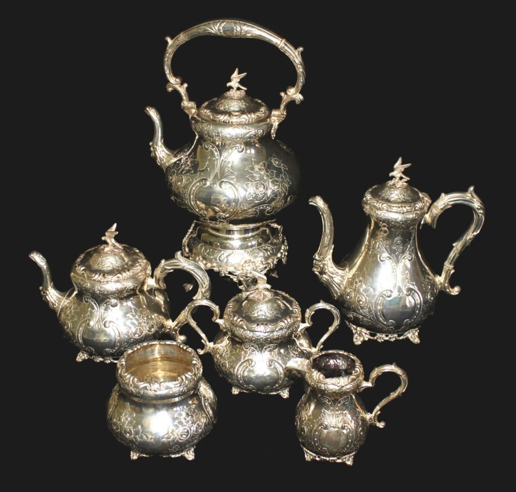 6 Piece Silver Plated Tea Set: Large, hand chased, heavily plated silver 6 piece English tea set. Made in England. Largest urn measures 8"d x 18". Creamer measures 3 1/2" x 5" Dimensions: 8"d x 18" Style/Time Period: 1880's