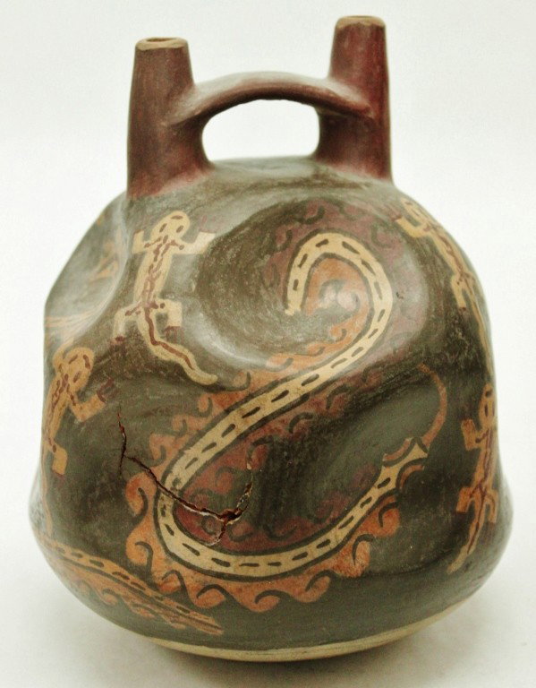 Pre-Columbian Stirrup Vessel. Nazca 500AD: Pre-Columbian Stirrup Vessel Decorated with Painted Lizards and Snakes. Nazca, Peru 500AD. Shrinkage crack apparent, as shown in first photo. Original glaze. Measurements: 5"d x 6 1/2"t Year/Era: Pre-