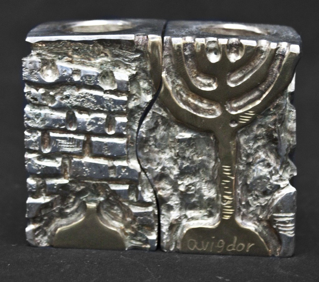 Interlocking Judaica Candle Sticks: Depicts wailing wall and menorah, signed Avigdor. Silver and god wash. Measurements: 3.25" x 1.5" x 2.75"