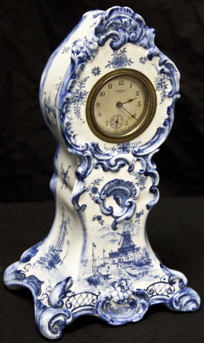 Delph Blue And White Porcelain Clock: Delph Blue And White Porcelain Clock Depicting Windmill And Floral Motifs. Excellent Condition. 6" x 10 1/2" x 4"