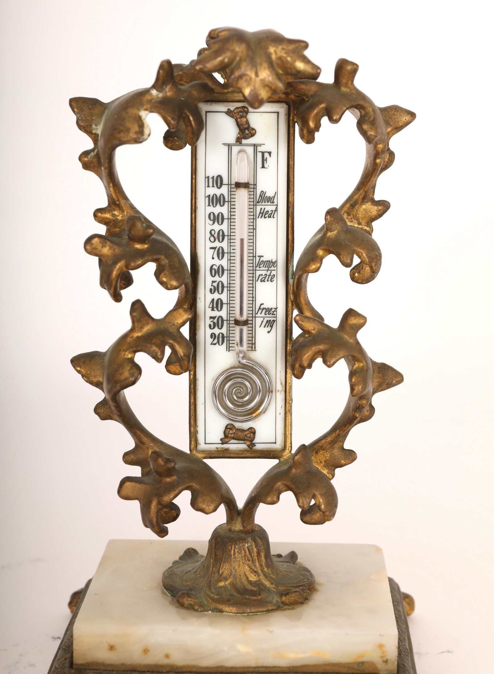 19c Bronze Rococo Thermometer on Marble Plinth: 19th Century Bronze Rococo style thermometer on marble plinth. The thermometer is housed within the Rococo leaf form frame with two bronze bows mounted on the thermometer, one above and one below. Exc