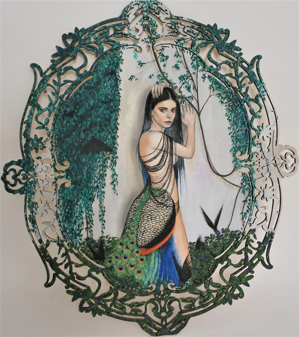 Julia Gabrielov Oil on Laser Cut Wood “Ravyn": Julia Gabrielov oil painting on laser cut wood, titled “Ravyn.” Partially nude girl with peacock tail painted on board with fret work, gingerbread style border. Excellent condition. Measures 20”