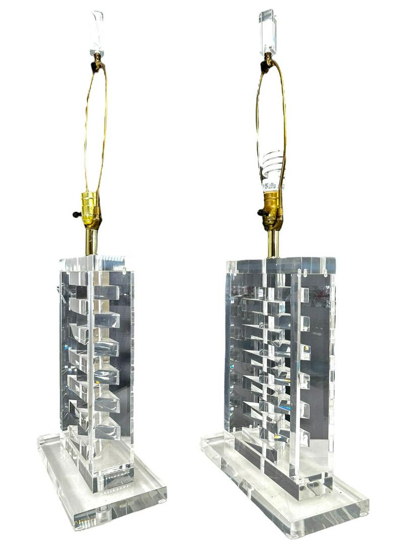 Pr Lucite Lamps Rectangular Form Stack Interior: Pair of Lucite lamps. Rectangular form with stacked triangle interior. Excellent condition. Measure 12" x 5.5" x 18" to switch.