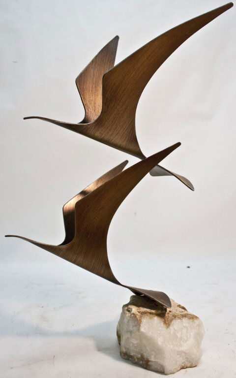 C. Jere Patinated Steel Sculpture. Birds in Flight: Patinated steel sculpture depicting two albatrosses in flight by Curtis Jere. Mounted on quartzite. Signed on tail feather, "C. Jere, '81". Measurements: 13" x 12" x 22.5" Period: Mid Century / Modern