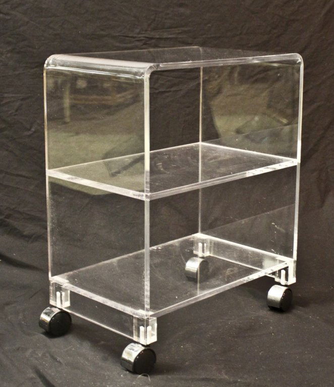 3-Tiered Lucite Utility Cart: 3-tiered Lucite utility cart. Measurements: 18.5" x 11.5" x 23.25" Period: Mid Cenury / Modern