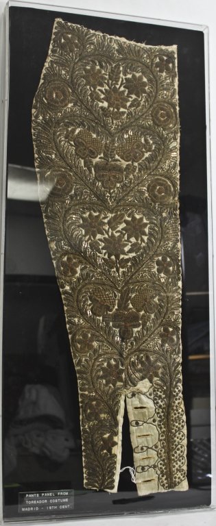 19 C Toreador Costume Pants Panel, Framed: Mounted and framed pants panel from 19th century Toreador costume. Intricately embroidered with tones of green, grey, gold and biege. Measurements: 30.5" x 13" Period: 19th Century