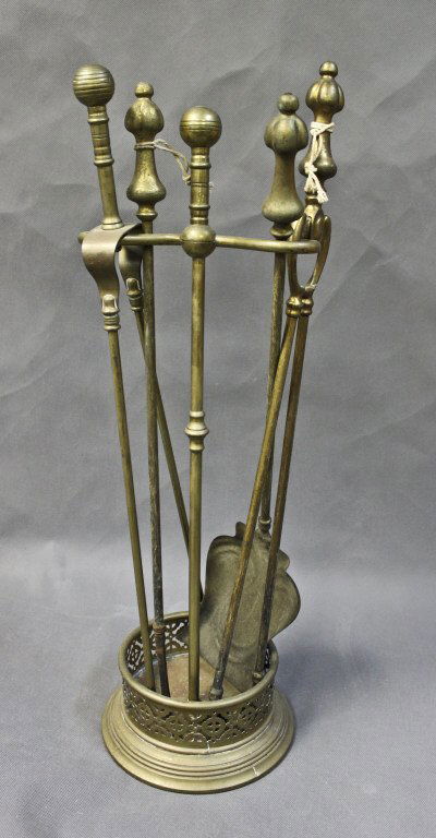 (5) Pieces 19th Century Brass Fireplace Tools: Lot of (5) 19th century Georgian brass fireplace tools. (2) tongs, (1) poker, (1) shovel, and holder. Measurements: 9"d x 26" (holder) Period: 19th Century