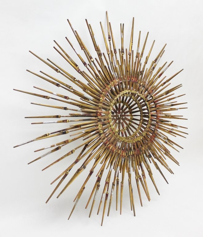 Large Sunburst Nail Sculpture Gold & Silver Gilt: Radial sculpture of a sunburst or sea urchin?. Constructed of steel nails with silver and gold leaf, in the manner of Curtis Jere. Measurements: 27" dia x 3" Style: Modern