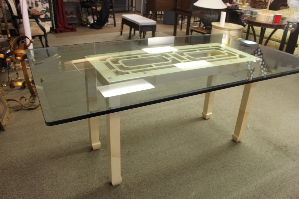 Henredon Faux Goat Skin Dining Table Glass Top: Henredon faux goat skin dining table with a glass top. Could also be used as a sofa table if glass top is replaced with smaller piece. Buttons have been replaced under glass with loss to finish under