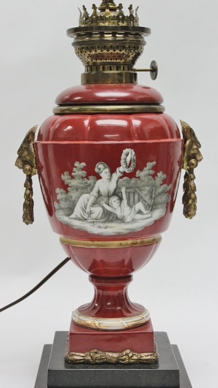 19thC French Porcelain & Bronze Oil Lamp: 19th century French porcelain & dore bronze mounted oil lamp with classical decorations. Measurements: 6.5" x 6.5" x 17.5 to base of harp.