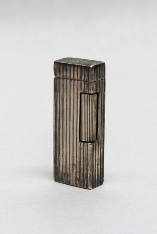 Dunhill Sterling Silver Petrol Lighter: Dunhill sterling silver petrol Rollagas style lighter. Measurements: 1 x .5" x 2.5"" Artist: Dunhill Style: 19th Century