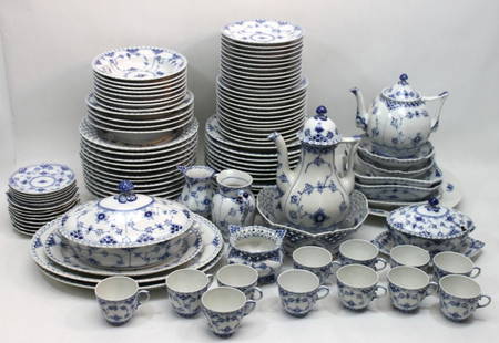 Royal Copenhagen "Blue Fluted Full Lace" China: Large set of Royal Copenhagen "Blue Fluted Full Lace" china designed by Arnold King, production started in 1888. The bulk of this set appear to be factory seconds. Set includes a coffee pot, tea pot,