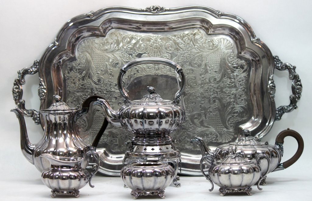 (7) Pc. Community, Melon" Silver Plated Tea Set": Sheffield reproduction by Community silver plated tea set. Melon" pattern, includes tray: 31" x 18", creamer: 5.5" x 4.5" x 4.5", teapot: 11" x 7" x 5.25", handled sugar bowls: 6" x 5" x 4" each, wast