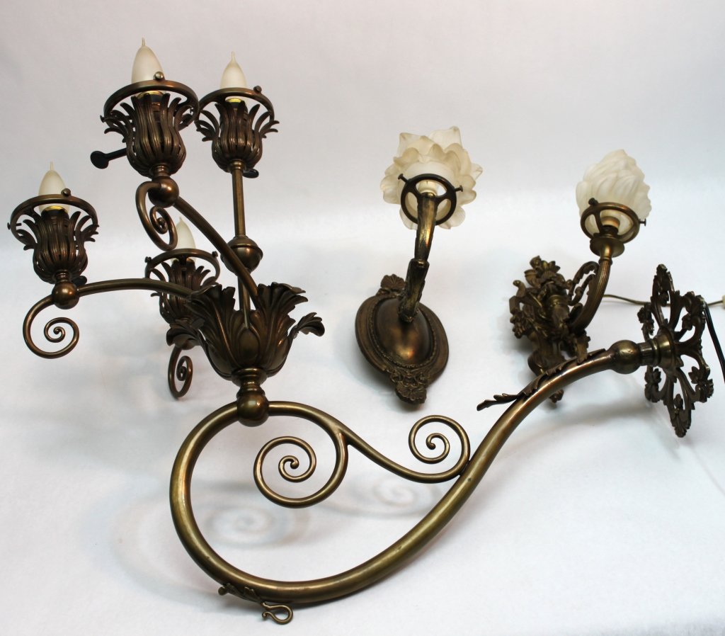 (3) Brass Renaissance Revival Wall Sconces: Group of three brass Renaissance revival wall sconces. Two one light fixtures with French glass shades, minor chip to one of them, one measures 5 x 8" x 10.25" and the other measures 4" x 8" x 12". Th